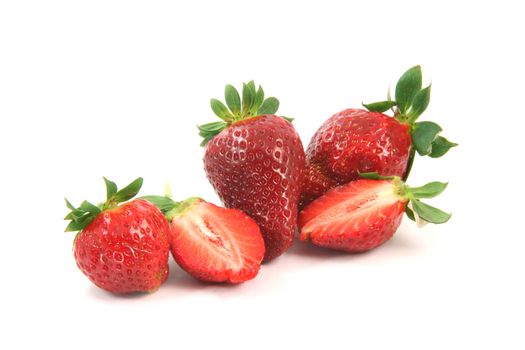 group of strawberries on is cut in half isolated on white background healthy eating
