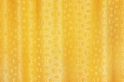 golden colored curtains textured background with ornaments