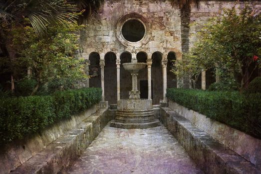 In the courtyard of the medieval monastery of Dubrovnik, Croatia. Postcard from Croatia. More of my images worked together to reflect age and time.