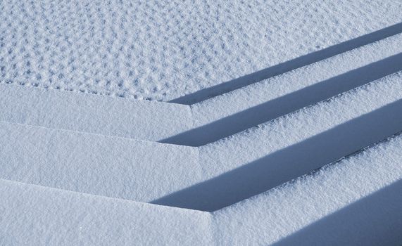 Snowclad steps on frosty morning in January - Denmark