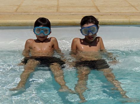 two boys with goggles and snorkels