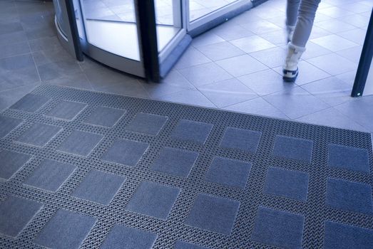 Girl leaving a hospital through a revolving door - Denmark.