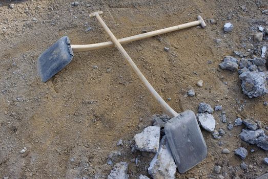 Two empty shovels during a lunch break at a Danish building site.