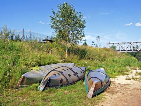 three old boats ashore