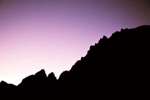 Peaks of the Dolomites in sunset seen from the mountain pass Pordoi - Italy. Or is a graph from a business with success?