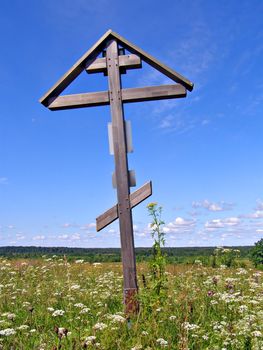 solitary cross on green field