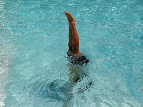 boy's playing in a swimming pool