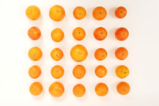 oranges arranged on a white background symbolizing teamwork, leadership............