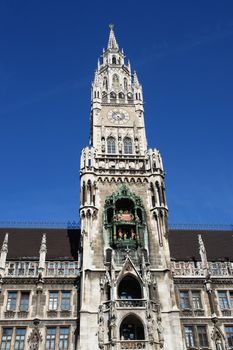 Munich- City Hall ;Marienplatz (Town Hall) with its mechanical clock, or Glockenspiel, in Munich, Germany............