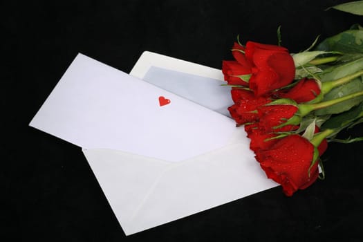 a loveletter on a dark background with rose and heart...........