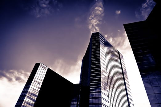 Large commercial building with with silhouette taken on a sunny day
