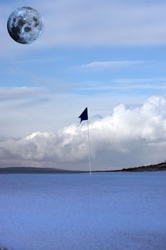 a snow covered links golf hole in ireland with blue flag and full moon in sky
