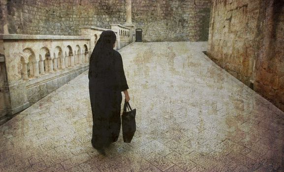 Nun on early morning shopping in the old city of Dubrovnik, Croatia.
