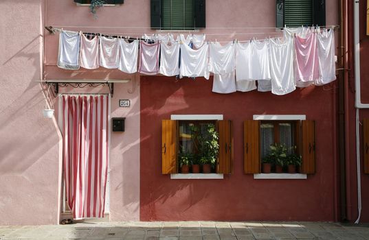 Colorful house on the island of Burano in the Venetian lagoon - Italy.