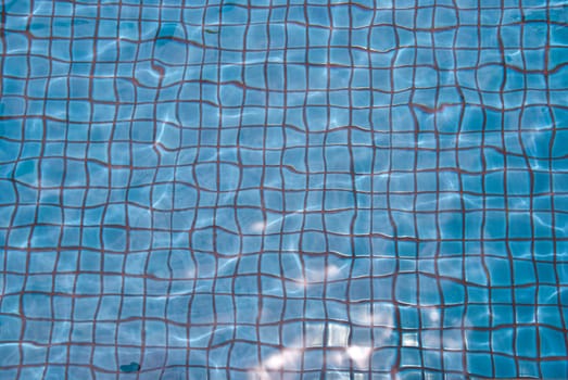 Swimming pool water texture taken on a sunny day
