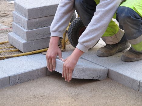 Paver on job. Constructing a difficult pattern.