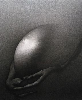 A pregnant just a few days before the delivery. Analog capture - silvergrains from the film to be seen.