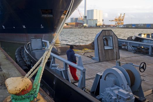 Tugs in the harbor of Esbjerg, Denmark at sunset.