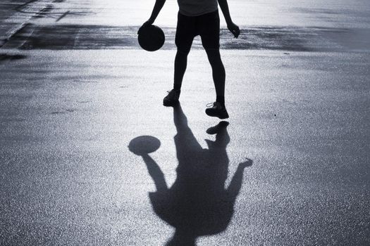 Street basketball just after the rain. Duotone.