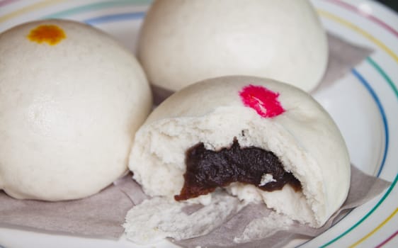 A display of Chinese steamed buns on dining table.