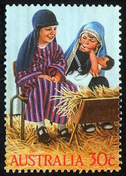 AUSTRALIA - CIRCA 2004: A greeting Christmas stamp printed in Australia shows children play to the Holy Family