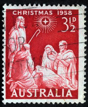 AUSTRALIA - CIRCA 1958 : A greeting Christmas stamp printed in Australia shows birth of Jesus Christ