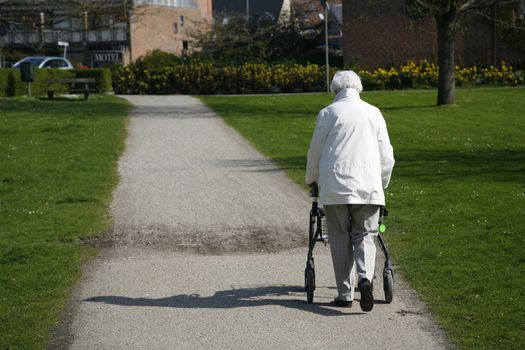 Senior woman with a walking frame.
