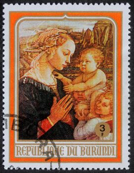 BURUNDI - CIRCA 1980: A greeting Christmas stamp printed in Burundi shows Madonna and Child