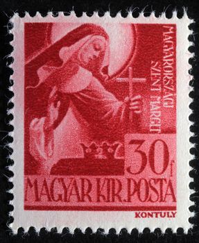 HUNGARY - CIRCA 1944: Stamp printed in Hungary shows Saint Margaret of Hungary