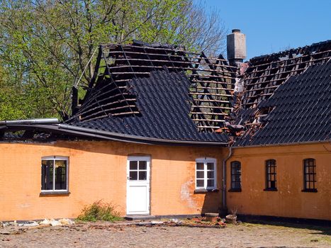 Details of ruins and remains of a burned down destroyed by fire house 
