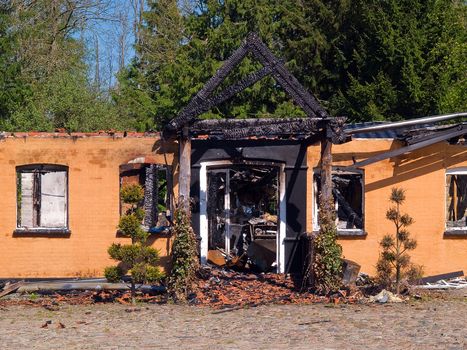 Details of ruins and remains of a burned down destroyed by fire house 