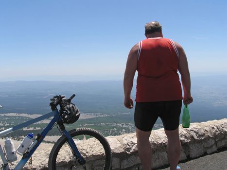 Cyclist on top of Mont Venteux, Provence, France - about 2000 m. above sea.