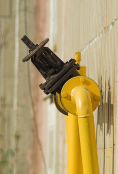 The gas gate, valve and yellow pipes. 