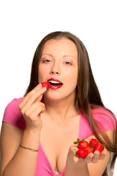 Beautiful girl stretches strawberries which is in her hand