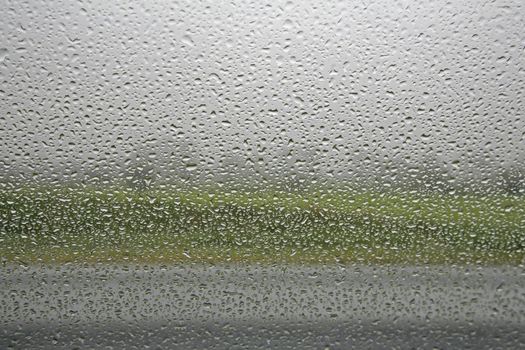 It�s raining outside - seen from inside a car. Space for text.