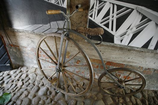 Retro bike in gateway. Kerteminde Museum, Funen, Denmark.