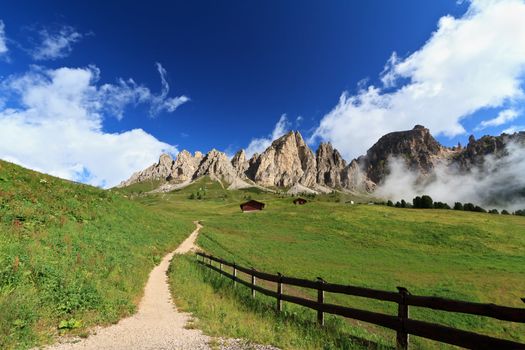 pathway in Gardena pass beneath Cir Dolomites mountain