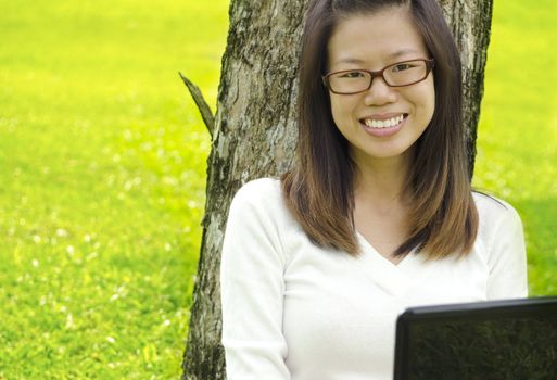 Asian Student Using Laptop Outside School Campus