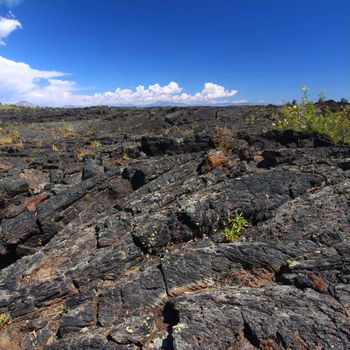 Volcanic rock covers the landscape at Craters of the Moon National Monument of Idaho.