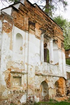 Old Ruined brick wall , windows and balcony