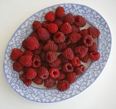 Raspberries on a plate for dessert.