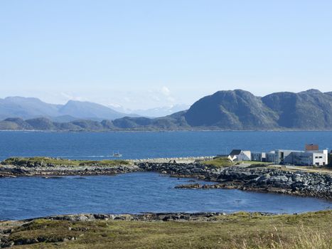 Fishing boat passing Runde, and island on the west coast of Norway