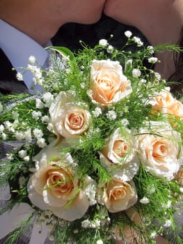Roses; a bouquet of the bride; flowers; the red; the scarlet; greens; leaves; a plant; vegetation 