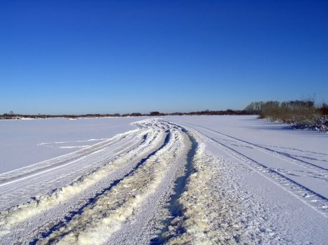 winter road on ice river
