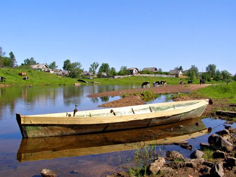 wooden boat near villages