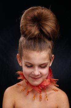 Portrait of elegant girl with make-up on the face. In studio on black background