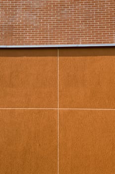 Modern building wall background. Construction details. Bricks and plaster.