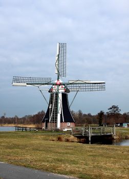 windmill on the lakeshore in the Netherlands