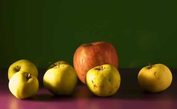 apples on a green background