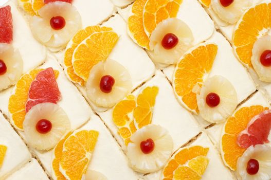 many fruit cakes with custard. suitable as background.